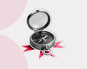 Open compass with a vintage design, resting on red, star-like rays. The background is light gray with soft pink arcs, conveying a sense of exploration.